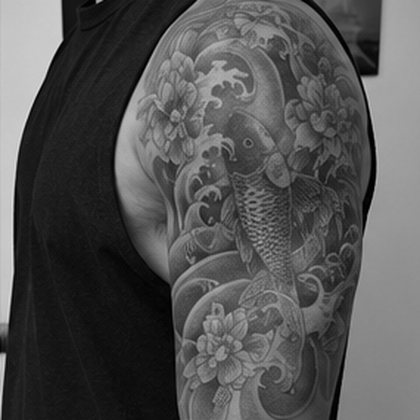 Japanese koi and lotus half sleeve in black and grey