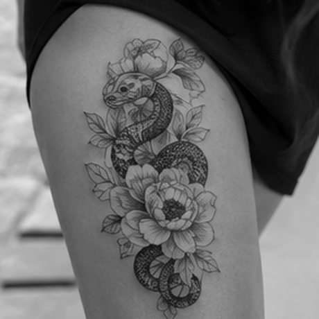Blackwork snake and peony thigh tattoo
